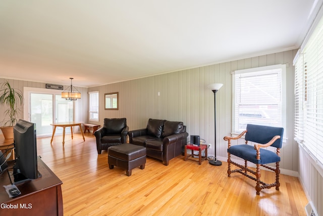 98 Meadowbrook Rd, Saratoga Springs, NY 12866 - living area with light wood finished floors and crown molding