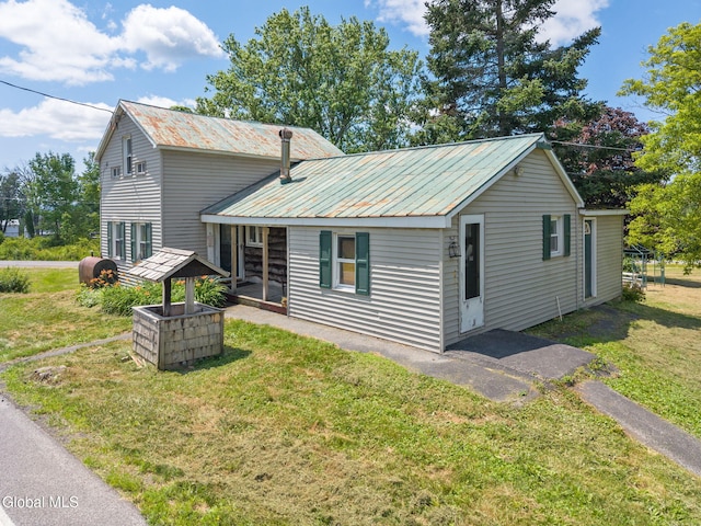 5530 State Highway 30a, Charleston, NY 12066 - view of front of house with a front lawn and a metal roof