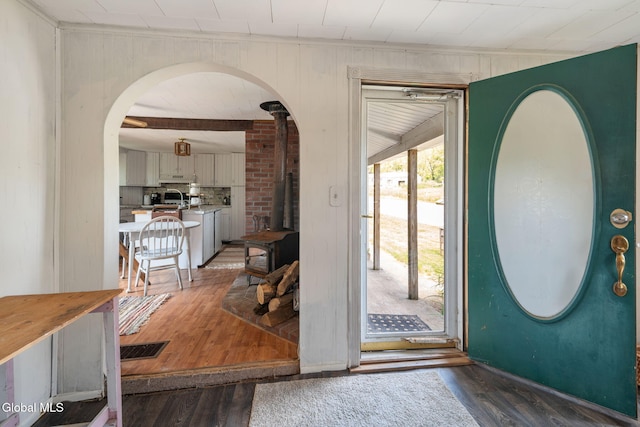 5530 State Highway 30a, Charleston, NY 12066 - entryway with a wood stove, wood finished floors, and arched walkways