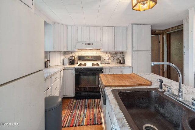 5530 State Highway 30a, Charleston, NY 12066 - kitchen featuring white appliances, ventilation hood, white cabinets, backsplash, and wood finished floors