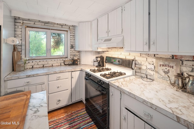 5530 State Highway 30a, Charleston, NY 12066 - kitchen with white gas stove, custom exhaust hood, light countertops, and white cabinets