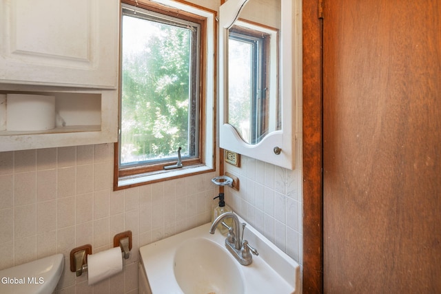 5530 State Highway 30a, Charleston, NY 12066 - bathroom featuring tile walls, plenty of natural light, and backsplash