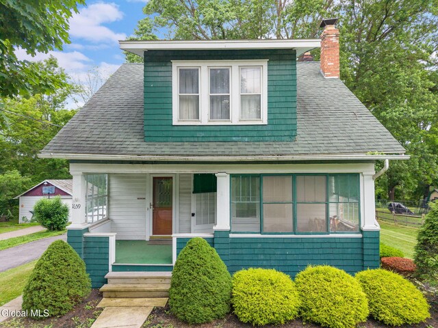 1659 State Route 7, Cobleskill, NY 12043 - bungalow-style home with covered porch, a chimney, and roof with shingles