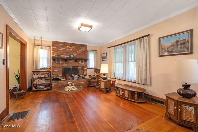 1659 State Route 7, Cobleskill, NY 12043 - living area with hardwood / wood-style flooring, crown molding, and a brick fireplace