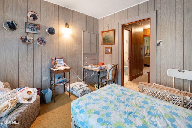1659 State Route 7, Cobleskill, NY 12043 - carpeted bedroom with wood walls and connected bathroom
