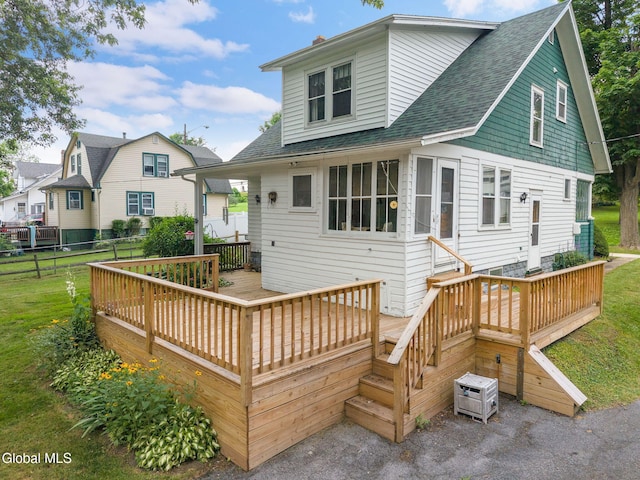 1659 State Route 7, Cobleskill, NY 12043 - rear view of house featuring roof with shingles and a deck
