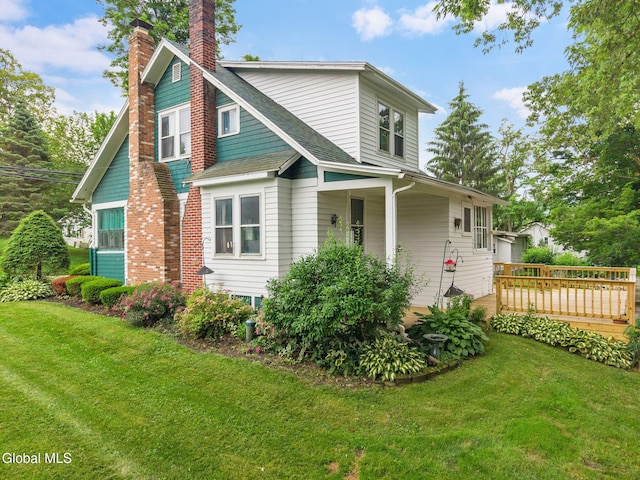 1659 State Route 7, Cobleskill, NY 12043 - view of front of house featuring a chimney, a shingled roof, a front lawn, and a wooden deck