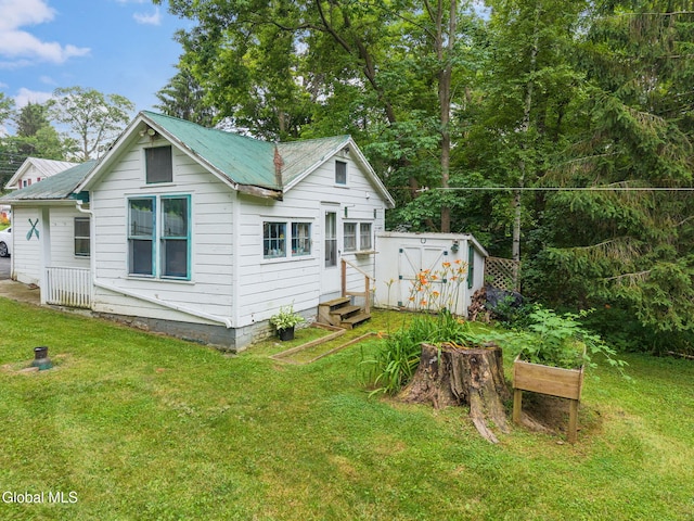 1659 State Route 7, Cobleskill, NY 12043 - back of property featuring entry steps, a lawn, and a metal roof