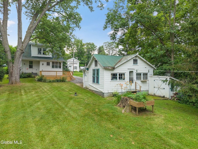 1659 State Route 7, Cobleskill, NY 12043 - back of property featuring a deck, a lawn, and a shed