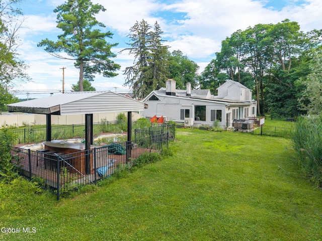654 Sand Creek Rd, Colonie, NY 12205 - fenced backyard featuring a carport and a jacuzzi