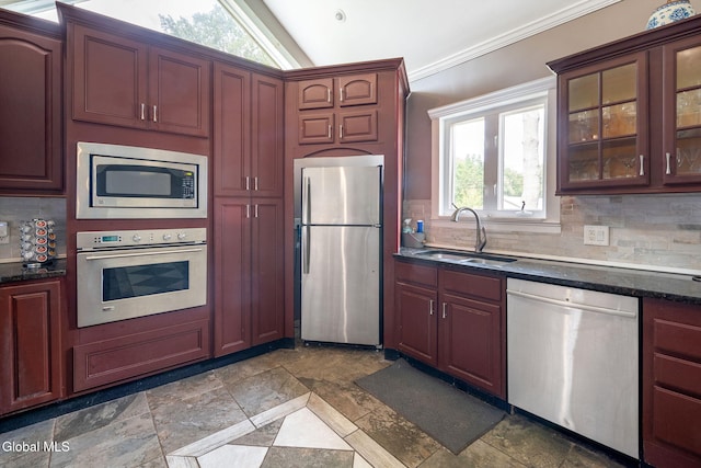 654 Sand Creek Rd, Colonie, NY 12205 - kitchen featuring stainless steel appliances, backsplash, ornamental molding, glass insert cabinets, and stone tile flooring
