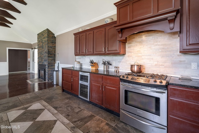 654 Sand Creek Rd, Colonie, NY 12205 - kitchen featuring gas stove, wine cooler, decorative backsplash, crown molding, and under cabinet range hood