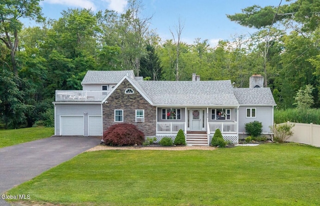 654 Sand Creek Rd, Colonie, NY 12205 - view of front facade featuring a porch, stone siding, a garage, a chimney, and driveway