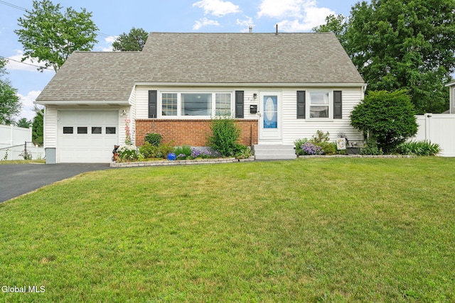 27 Terry Ave, Guilderland, NY 12303 - view of front of home featuring a garage, driveway, brick siding, and roof with shingles