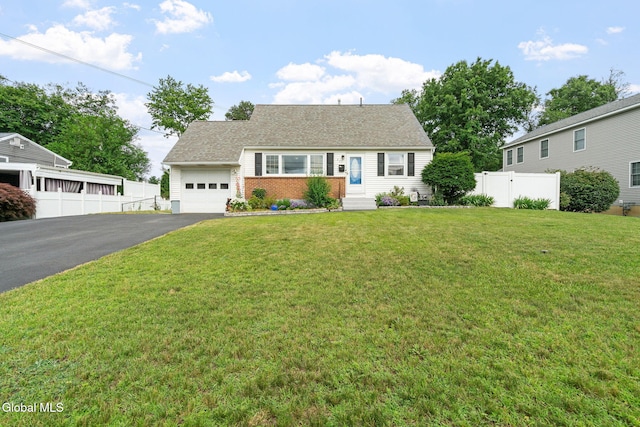 27 Terry Ave, Guilderland, NY 12303 - view of front of house featuring driveway, a garage, brick siding, and roof with shingles