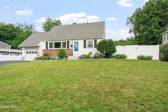 27 Terry Ave, Guilderland, NY 12303 - view of front facade featuring a garage, driveway, brick siding, and a shingled roof