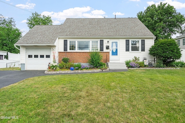 27 Terry Ave, Guilderland, NY 12303 - view of front of house with an attached garage, asphalt driveway, brick siding, and roof with shingles