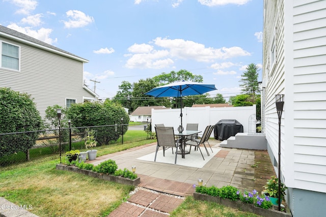 27 Terry Ave, Guilderland, NY 12303 - fenced backyard featuring area for grilling, a patio, and outdoor dining area