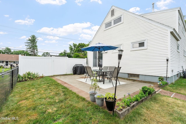 27 Terry Ave, Guilderland, NY 12303 - back of house featuring a fenced backyard and a patio area