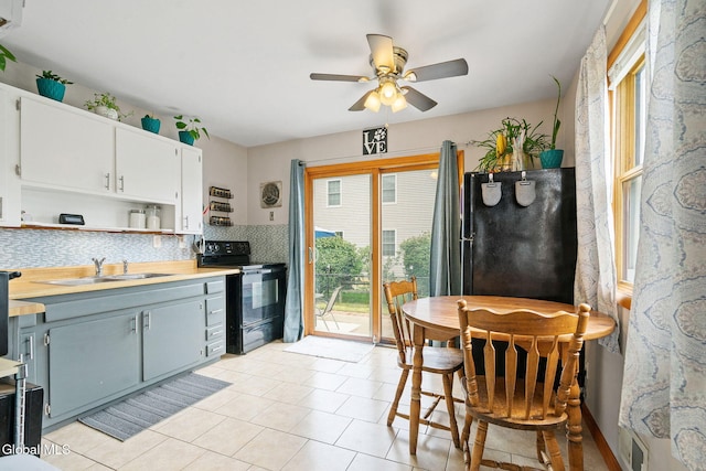 27 Terry Ave, Guilderland, NY 12303 - kitchen with black appliances, plenty of natural light, decorative backsplash, and ceiling fan