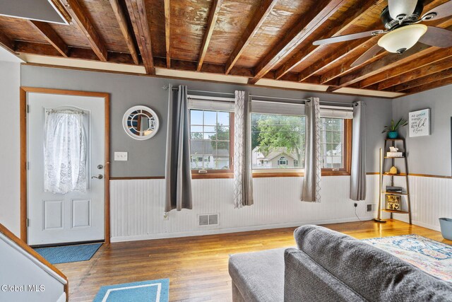 27 Terry Ave, Guilderland, NY 12303 - living area with wood finished floors, wainscoting, and a ceiling fan
