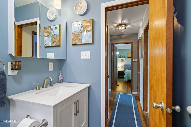 27 Terry Ave, Guilderland, NY 12303 - bathroom featuring wood finished floors, vanity, and connected bathroom