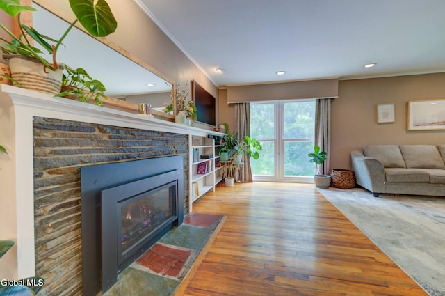 909 Ash Tree Ln, Niskayuna, NY 12309 - living area with ornamental molding, a fireplace, wood finished floors, and recessed lighting