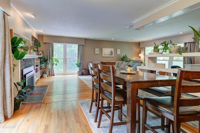 909 Ash Tree Ln, Niskayuna, NY 12309 - dining area with plenty of natural light, light wood-type flooring, a stone fireplace, and recessed lighting
