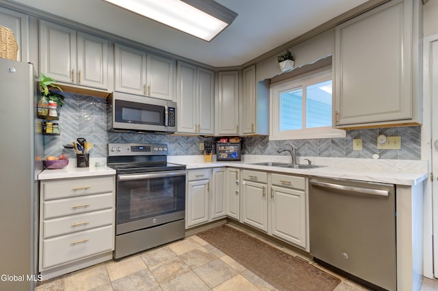 909 Ash Tree Ln, Niskayuna, NY 12309 - kitchen with stainless steel appliances, tasteful backsplash, and light countertops