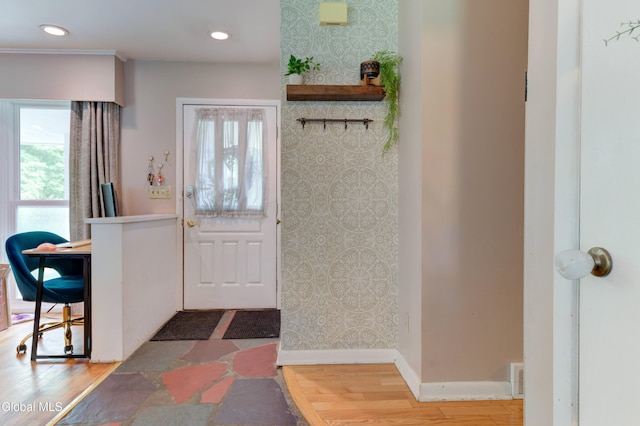909 Ash Tree Ln, Niskayuna, NY 12309 - foyer featuring wallpapered walls, wood finished floors, recessed lighting, and an accent wall