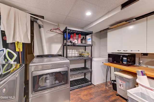 909 Ash Tree Ln, Niskayuna, NY 12309 - laundry room with washing machine and dryer, cabinet space, recessed lighting, and dark wood finished floors