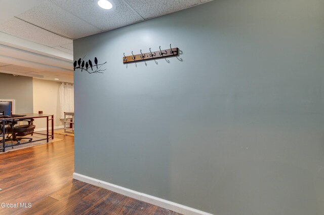 909 Ash Tree Ln, Niskayuna, NY 12309 - corridor featuring dark wood-style floors and a drop ceiling