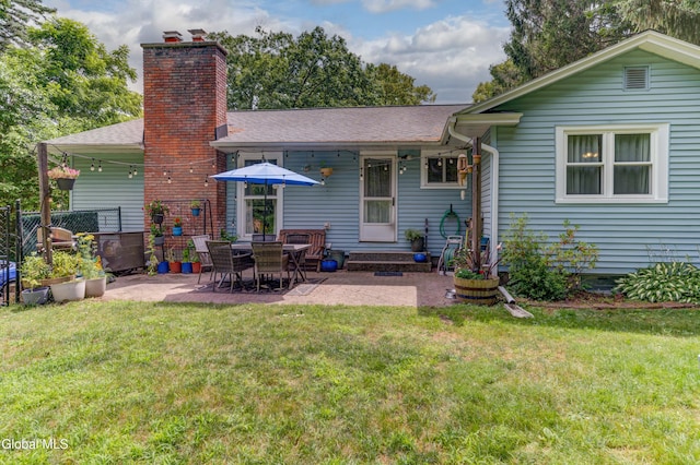 909 Ash Tree Ln, Niskayuna, NY 12309 - back of property with a patio area and a chimney