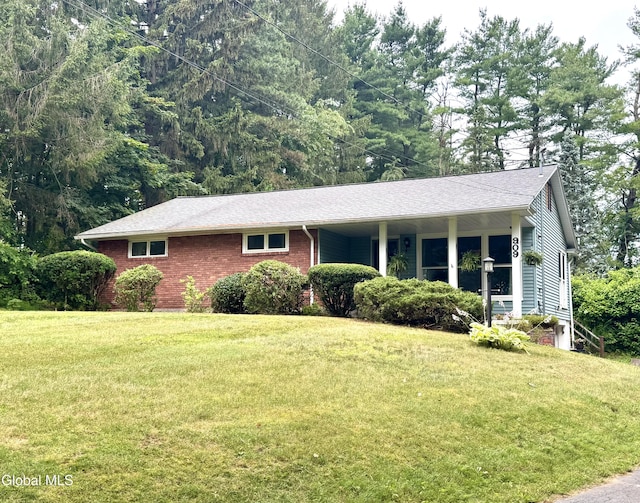 909 Ash Tree Ln, Niskayuna, NY 12309 - ranch-style house with a front lawn, brick siding, and a shingled roof