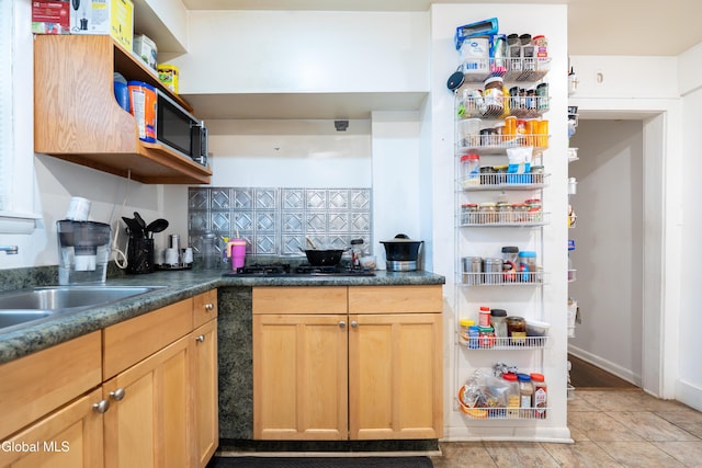 8-10 Spruce St, Rensselaer, NY 12144 - kitchen featuring open shelves, gas stovetop, decorative backsplash, light tile patterned floors, and dark countertops