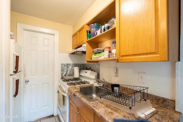 8-10 Spruce St, Rensselaer, NY 12144 - kitchen featuring white appliances, under cabinet range hood, open shelves, decorative backsplash, and light stone countertops