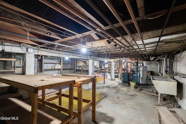 8-10 Spruce St, Rensselaer, NY 12144 - unfinished below grade area with water heater and a sink