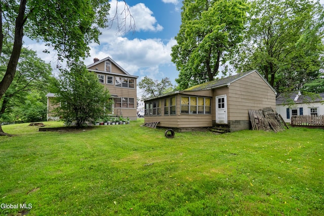8-10 Spruce St, Rensselaer, NY 12144 - rear view of property featuring a lawn and a sunroom