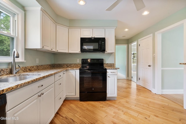 1226 Sumner Ave, Schenectady, NY 12309 - kitchen featuring black appliances, white cabinetry, a ceiling fan, light wood-style flooring, and recessed lighting