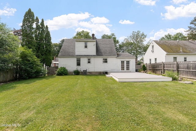 1226 Sumner Ave, Schenectady, NY 12309 - rear view of house featuring french doors, a patio area, a fenced backyard, and a chimney