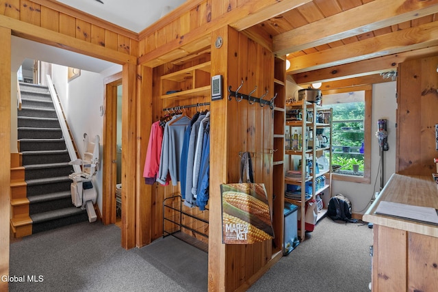 135 Willow St, Guilderland, NY 12084 - interior space with carpet, stairs, wood walls, and beam ceiling