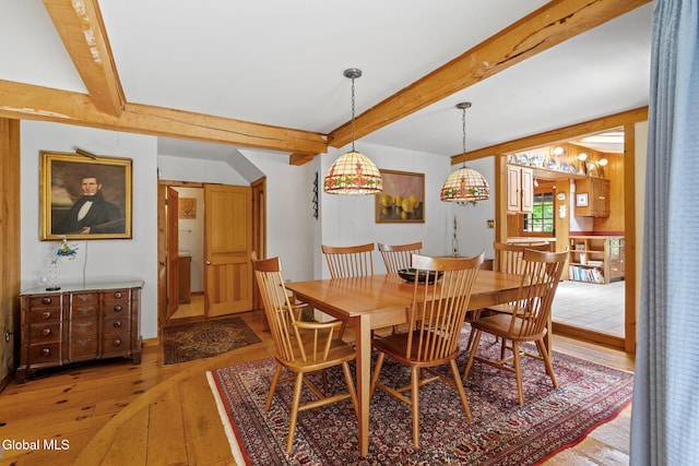 135 Willow St, Guilderland, NY 12084 - dining area with light wood-style floors and beamed ceiling