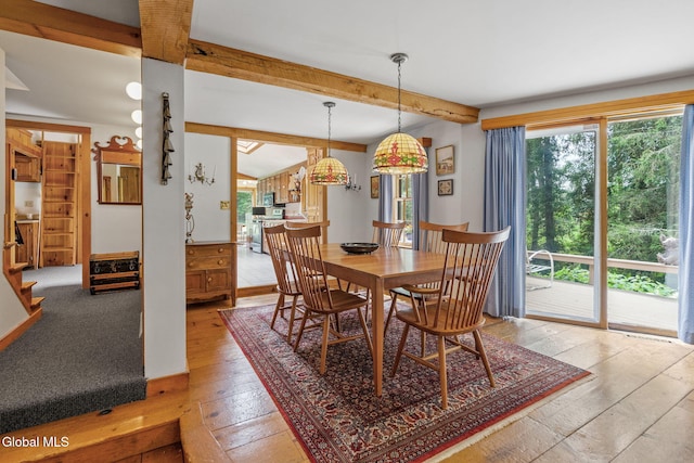 135 Willow St, Guilderland, NY 12084 - dining area with beamed ceiling and light wood-style flooring