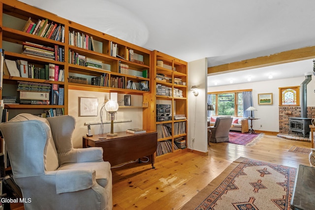 135 Willow St, Guilderland, NY 12084 - sitting room featuring hardwood / wood-style flooring and a wood stove