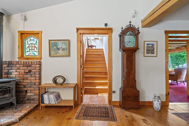 135 Willow St, Guilderland, NY 12084 - staircase with a wood stove and hardwood / wood-style flooring