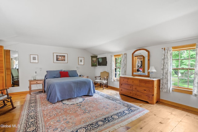 135 Willow St, Guilderland, NY 12084 - bedroom featuring light wood-style flooring and lofted ceiling