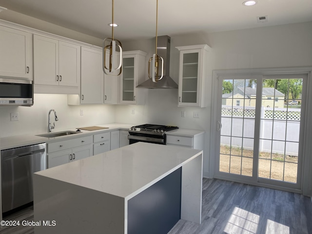 3 Priddle Ln, Colonie, NY 12110 - kitchen with stainless steel appliances, wall chimney exhaust hood, recessed lighting, light countertops, and white cabinets