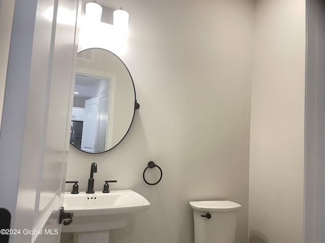 3 Priddle Ln, Colonie, NY 12110 - half bathroom with toilet and a sink