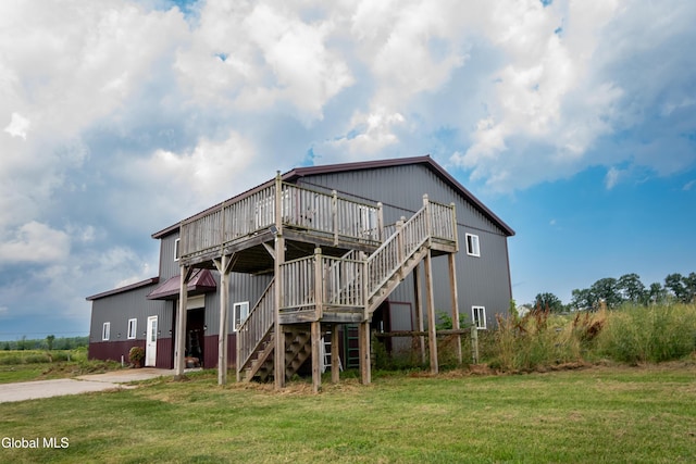 367 Buel Rd, Canajoharie, NY 13317 - back of property with stairs, a wooden deck, and a yard