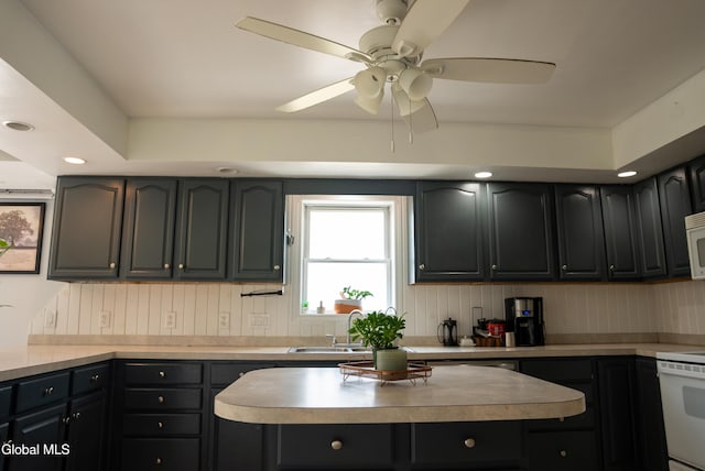 367 Buel Rd, Canajoharie, NY 13317 - kitchen featuring white appliances, ceiling fan, a kitchen island, light countertops, and recessed lighting